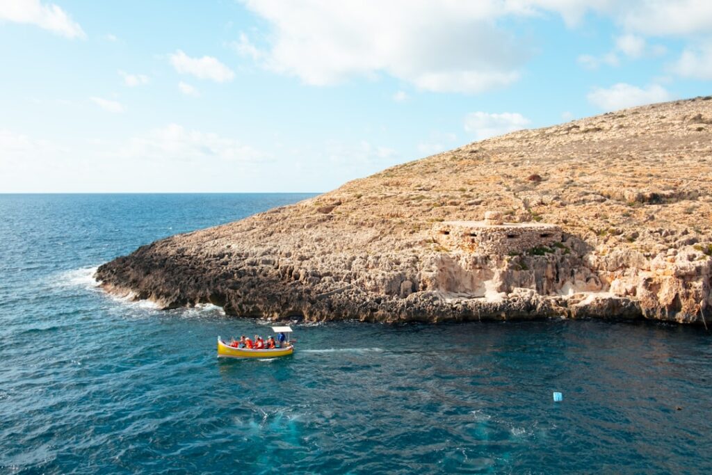 A small boat in the middle of a body of water